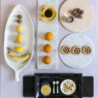 Rund ostplatta i vit eller svart marmor tillverkad i Italien - Kirby Viadurini